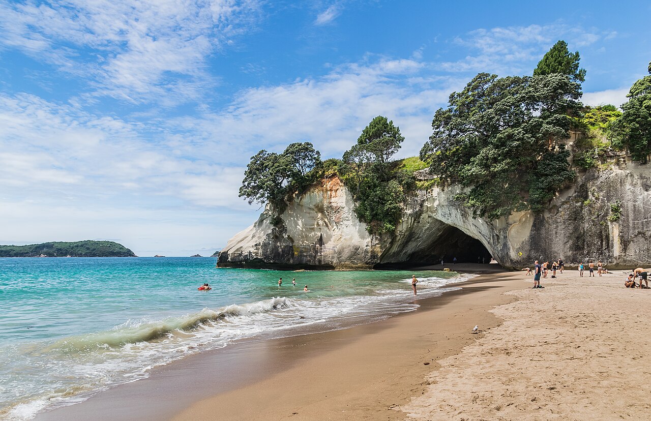 Cathedral Cove naturally sculpted limestone cathedral arch connecting golden sand beaches and turquoise sea